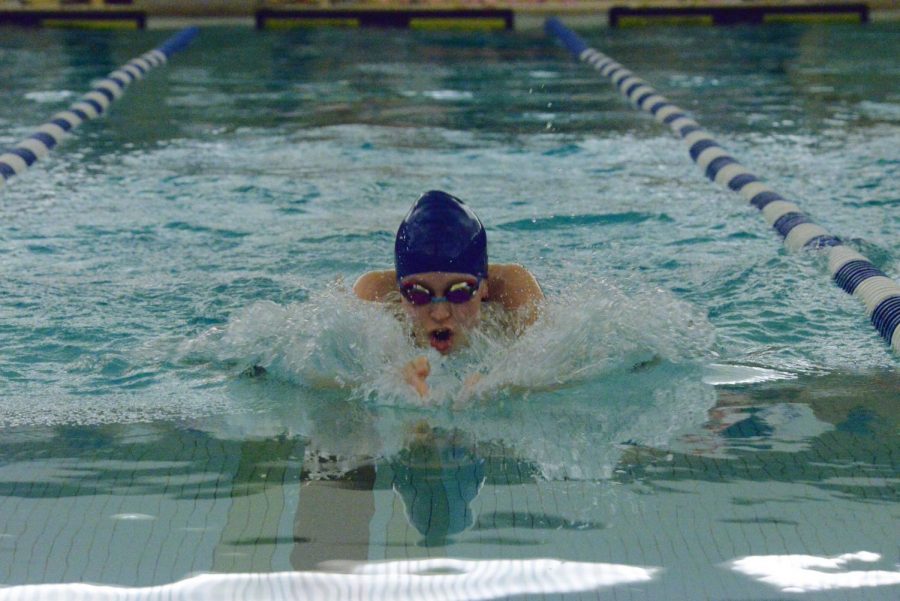 Current senior Julia Faust executes a flawless breast-stroke in a meet from last season.