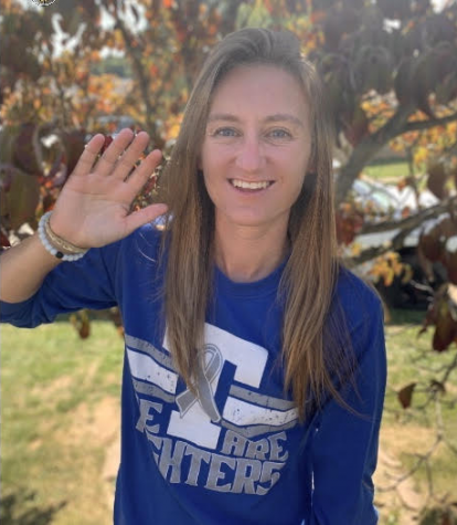 Mrs. Harris waving hello and preparing to start her day at Trinity High School.