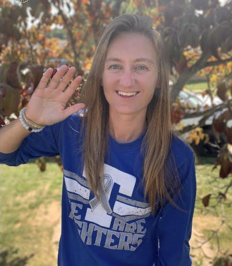 Mrs. Harris waving hello and preparing to start her day at Trinity High School. 