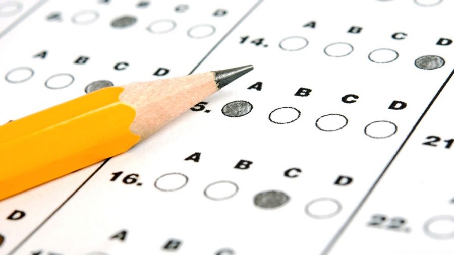 A students answer sheet is pictured on their desk after their standardized test is complete.  