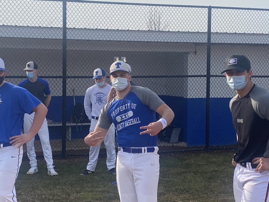 Senior Brandon Robaugh poses for a goofy picture while the baseball team gets ready to practice. 