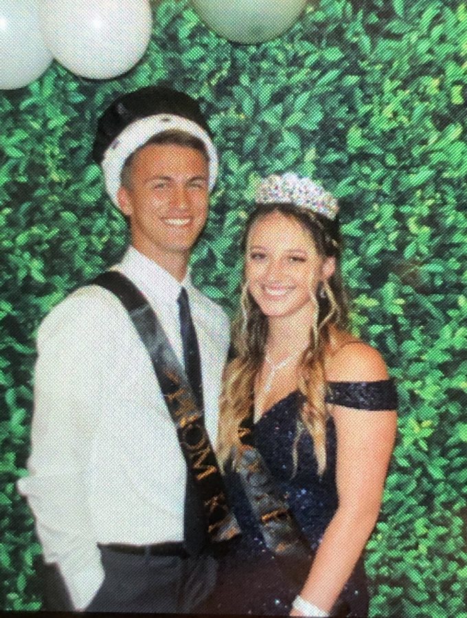 Elijah Cincinnati and Skylar Clawson smiling for winning Prom King and Queen.