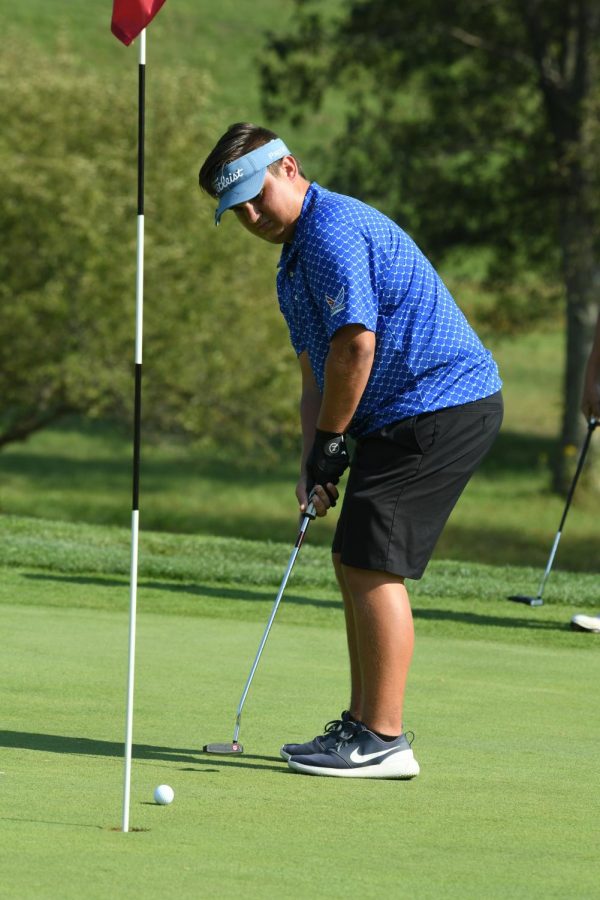 Junior Easton Morris prepares to make a put. Trinity students can come out to support golf players, such as Morris, throughout the month of October.