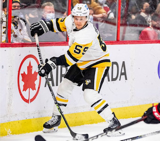 Left Winger Jake Guentzel shoots for a goal. This is Guentzels sixth season with the Penguins. He has scored a total of 126 goals and had 142 assists, as of November 18th.