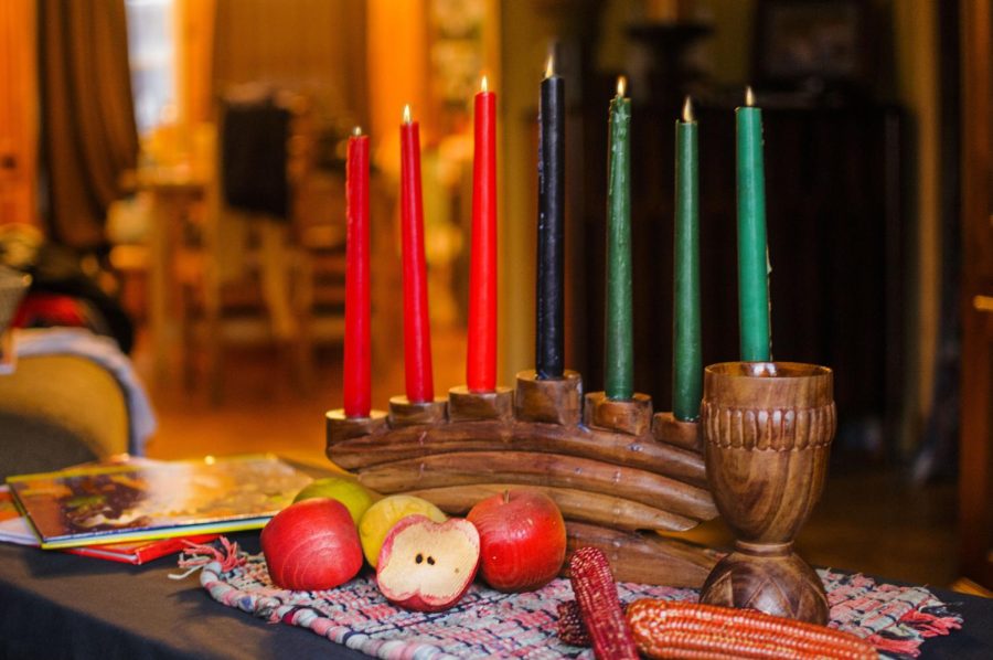 The candles used in Kwanzaa are usually placed inside of a Kinara. Also during Kwanzaa, an African feast called a Karamu is held with traditional foods. 