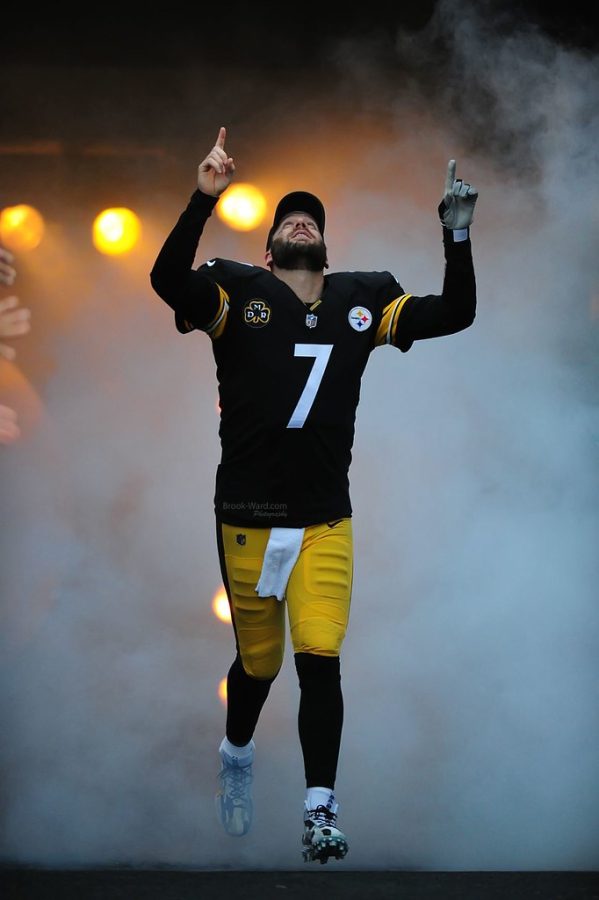 Ben Roethlisberger is pumped up for the game and enters the field amidst smoke and flashing lights to show that he is a force not to be reckon with!  Photo courtesy of Brook Ward via Flickr. 