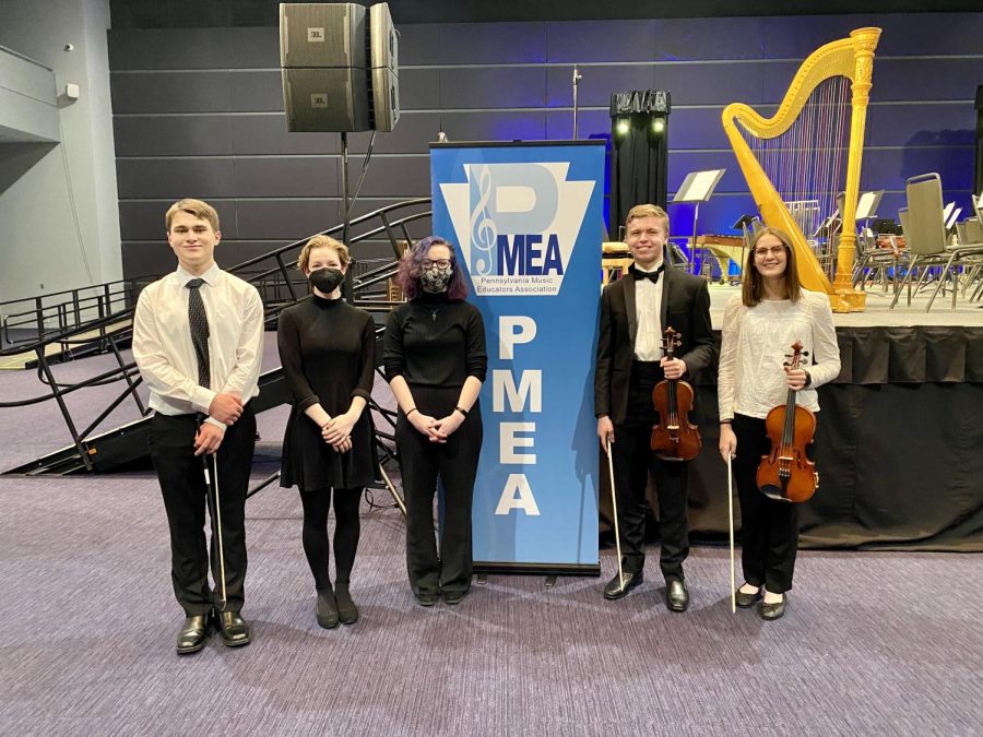 Trinity orchestra students gather for a photo before the PMEA District 1 orchestra concert. The concert took place on January 15 in Pittsburgh. 