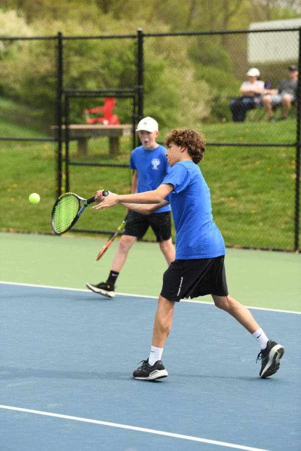 Junior Thomas Wickam gets ready to send the ball back over the net in hopes of gaining a point.     