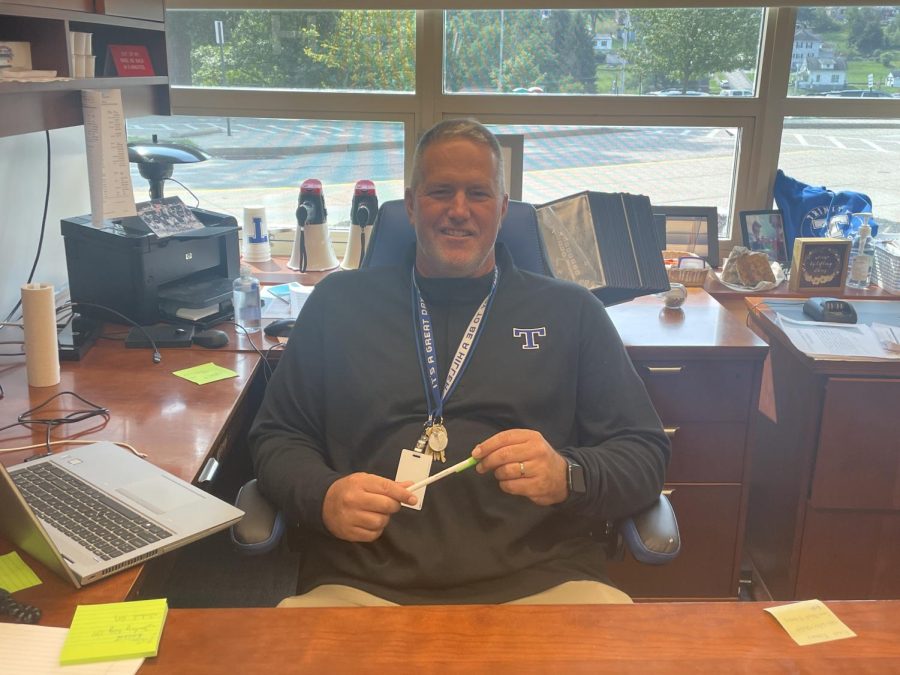 Assistant principal sits at his desk in the Main Office. In addition to serving as assistant principal, Mr. Knause is also the head coach of the Trinity football team.