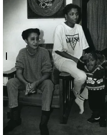 Glenda Cleveland watches the news with her daughter and grandson in 1992. Throughout the years, Cleveland stayed up-to-date on Dahmers case and fought for justice in the legal system.