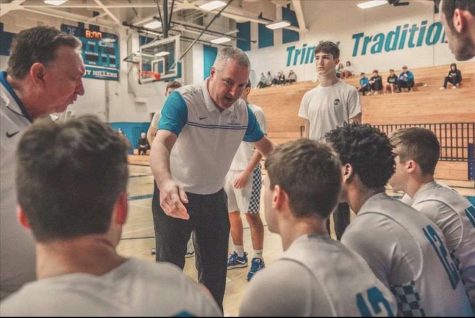 Coach Matthews gives the starting lineup: Dante DeRubbo, Andrew Collins, Owen Wayman, Tim Hodges, and Tyler Johnson a motivational talk to hype them up before their first home game. 
