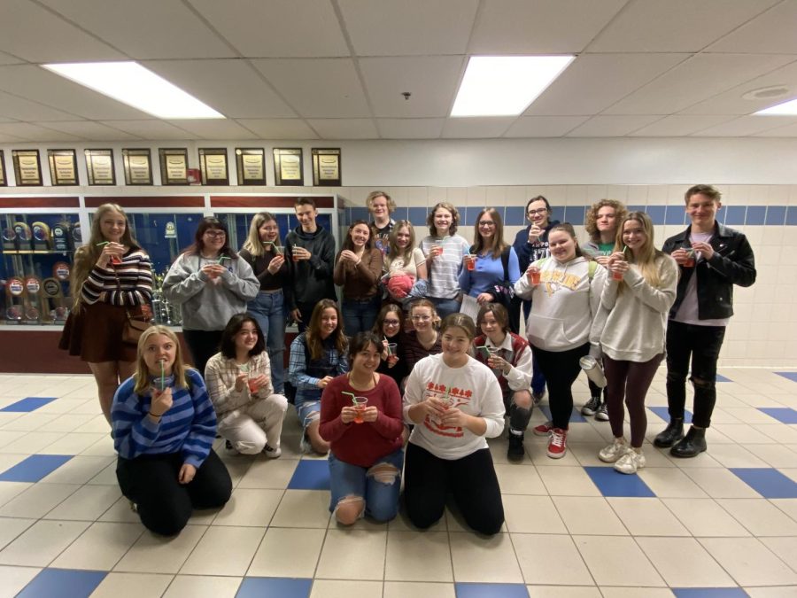 The members of the Shirley Tempos gather together in the hallway to celebrate after one of their rehearsals. The Tempos meet every Thursday in the music hallway and always strive to have a fun time!