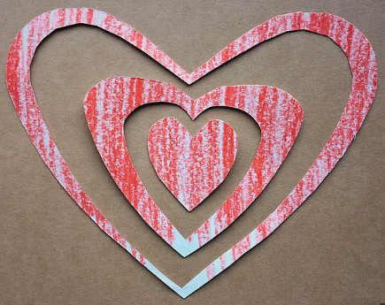 Pictured is a beginner level Valentine’s Day craft that is perfect for all ages. The materials needed for this craft are colored crayons, scissors and paper. All it takes is some simple folding to create cute heart shapes that can be used for anything. 