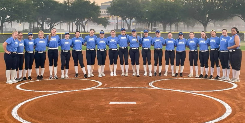 The+girls%E2%80%99+softball+team+poses+on+a+field+in+Orlando+after+practicing+for+their+game.+The+varsity+team+won+three+out+of+four+of+the+games+in+the+tournament.+Congratulations+girls%21%0A