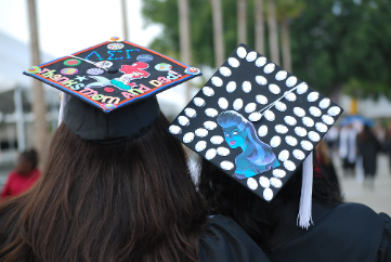 Pictured are two graduates with their own decorated caps. The possibilities are endless when it comes to personalizing graduation caps, and ideas can be found all over the internet!