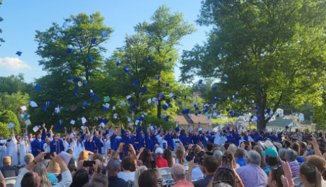 Pictured is a group of Trinity high school seniors participating in the infamous cap toss at the 2022 graduation ceremony. This is a beloved tradition that marks the end of every senior’s high school experience.