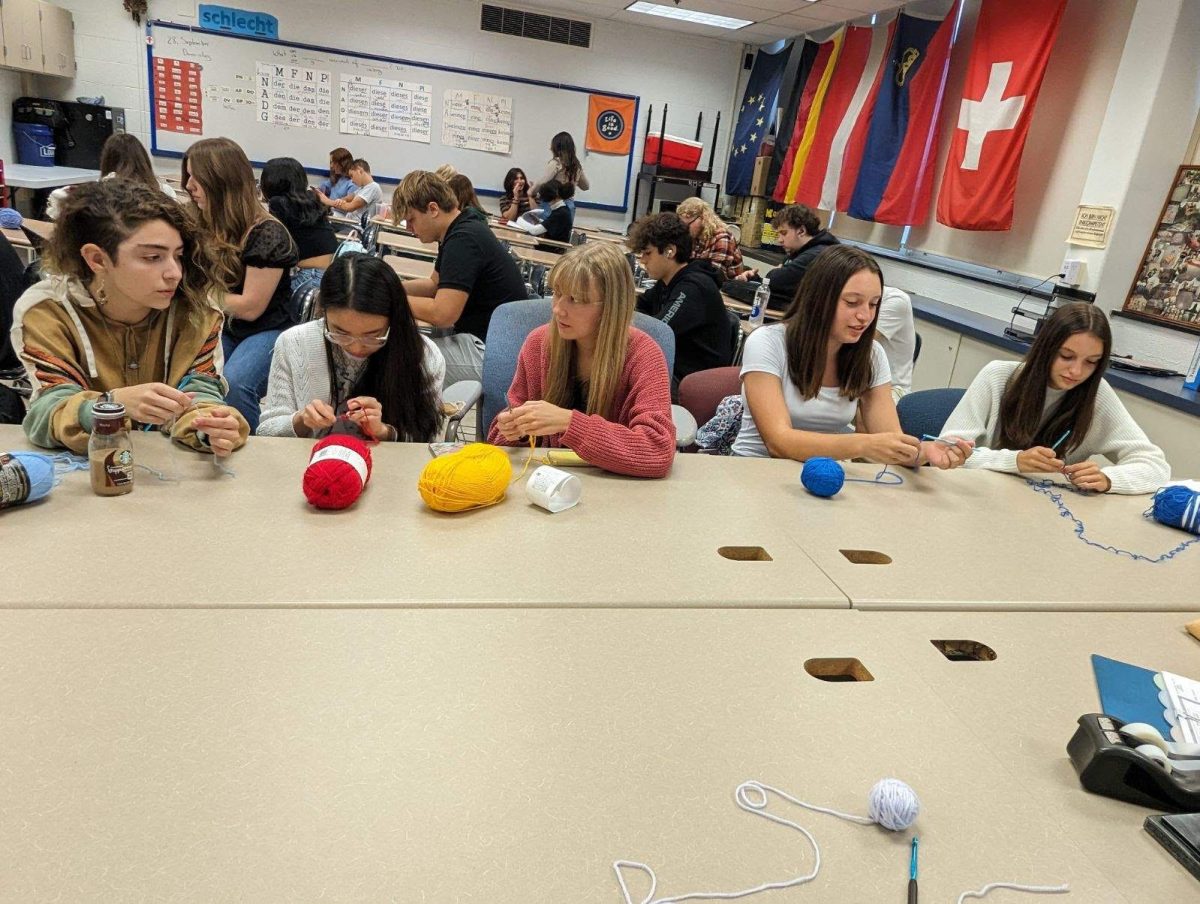 Members of the crochet club share strategies with each other at their meetings on Thursday in homeroom. They are also able to relax and socialize with other members while crocheting. 
