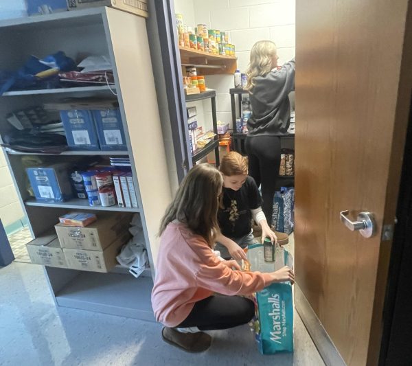The food pantry, located in room 209, is available for donations and pickups at any time during the school year. Students may talk to teachers or guidance counselors if they are interested in receiving a donation of supplies or submit an anonymous request for a pickup through Google Forms.