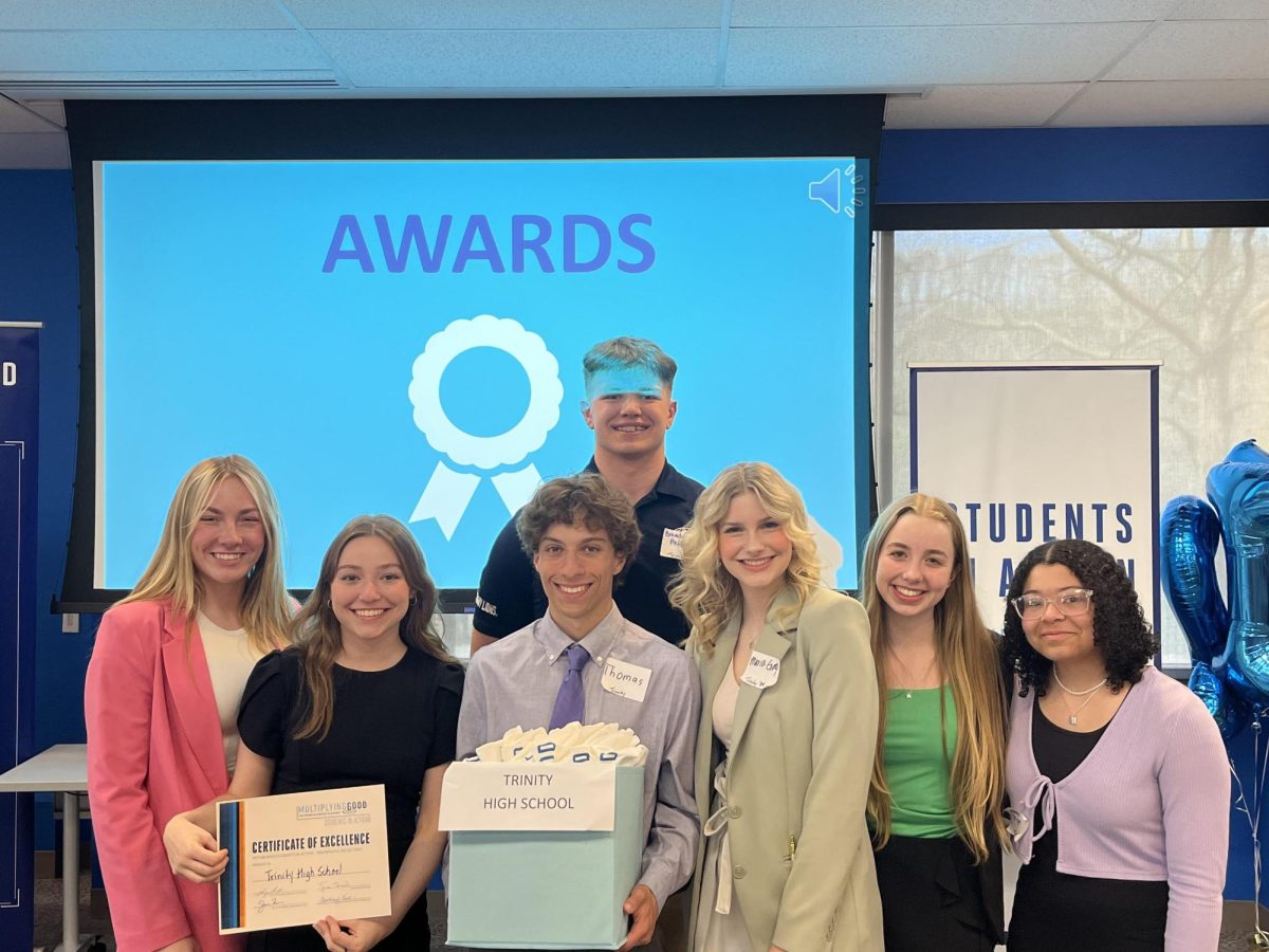 At the Multiplying Good competition last year for doing good, Trinity received the Gold Jefferson Award. Above is the TLC Student Leaders of the 2022-2023 school year, from left, Bella Muraco, Emily Wickham, Tommy Wickham, Braedon Helmkamp, Maria Giorgi, Addison Paul and Cadi Wright. 