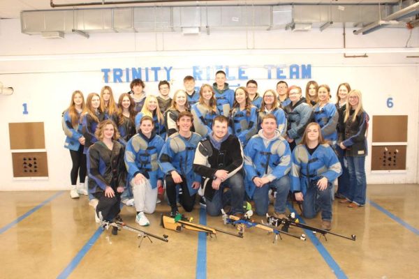 Trinity rifle team poses at the middle school range, where they practice each day. Make sure to wish the team luck for their next match!