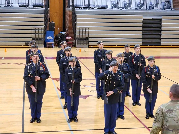 Williamson (front and center) leads an armed platoon at an annual drill competition. These competitions have taken place since 1982.
