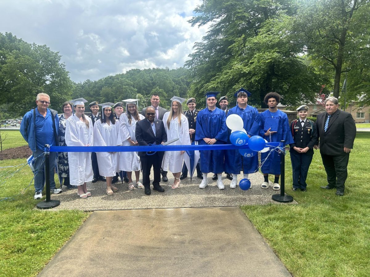 On+May+29%2C+2024%2C+a+ribbon+cutting+ceremony+was+held+to+celebrate+the+newly-built+graduation+stage%2C+made+possible+by+the+generous+donation+of+1975+alumnus+Mr.+Robin+Winston.++Winston%2C+Trinity+Central+administration%2C+members+of+the+school+board%2C+and+2024+graduates+participated+in+the+ceremony.+Winston+was+also+the+recipient+of+the+Trinity+Distinguished+Alumni+Award+in+2019.%0A