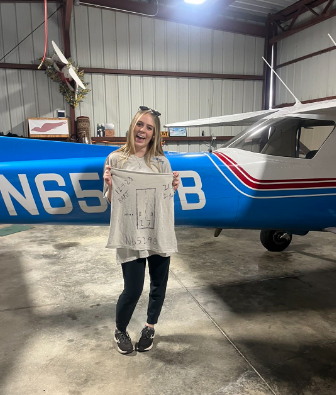 Pictured above is Timberly Gardner in December of 2023 after completing her first solo flight.