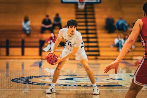 Senior Team Captain Jacob Dunkle leading the charge to victory at their first game vs Uniontown Area High School with a final score of Trinity with 60, and Uniontown with 48.