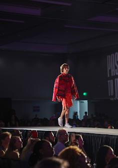 Pictured above is Poach walking down the runway at the Van Shawn Kayie Collection in Disney. Upon graduating, his main career goal was to model full time, which required no college education, leaving him an open lane to taking time off and pursuing his modeling career.
