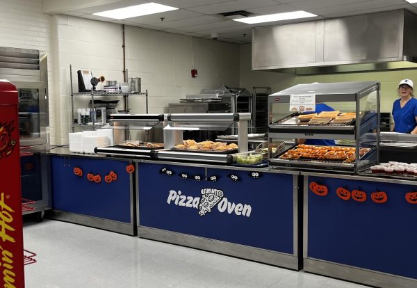 Hiller Hoagies sit stacked high in the Trinity High School cafeteria. Cafeteria workers prepare to serve the sandwiches to the first lunch period of the day. 