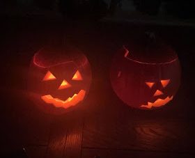 This picture shows two pumpkins with very different emotions. One is happy and spunky while the other is tired and maybe even sad. The littlest details can go a long way in showing the emotions of a pumpkin! 
