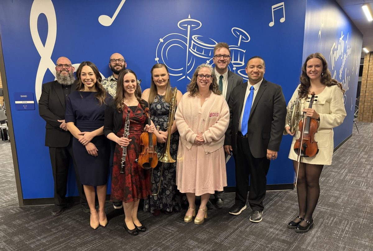 The second faculty recital took place on March 18, 2026. The music teachers pose with their instruments following the recital. From left, Mr. Komula, Mrs. Helinski, Mr. Hilty, Ms. Campus, Ms. Daniels, Mrs. Graham, Mr. Daviduk, Mr. Kibble, and Ms. Brendle. 