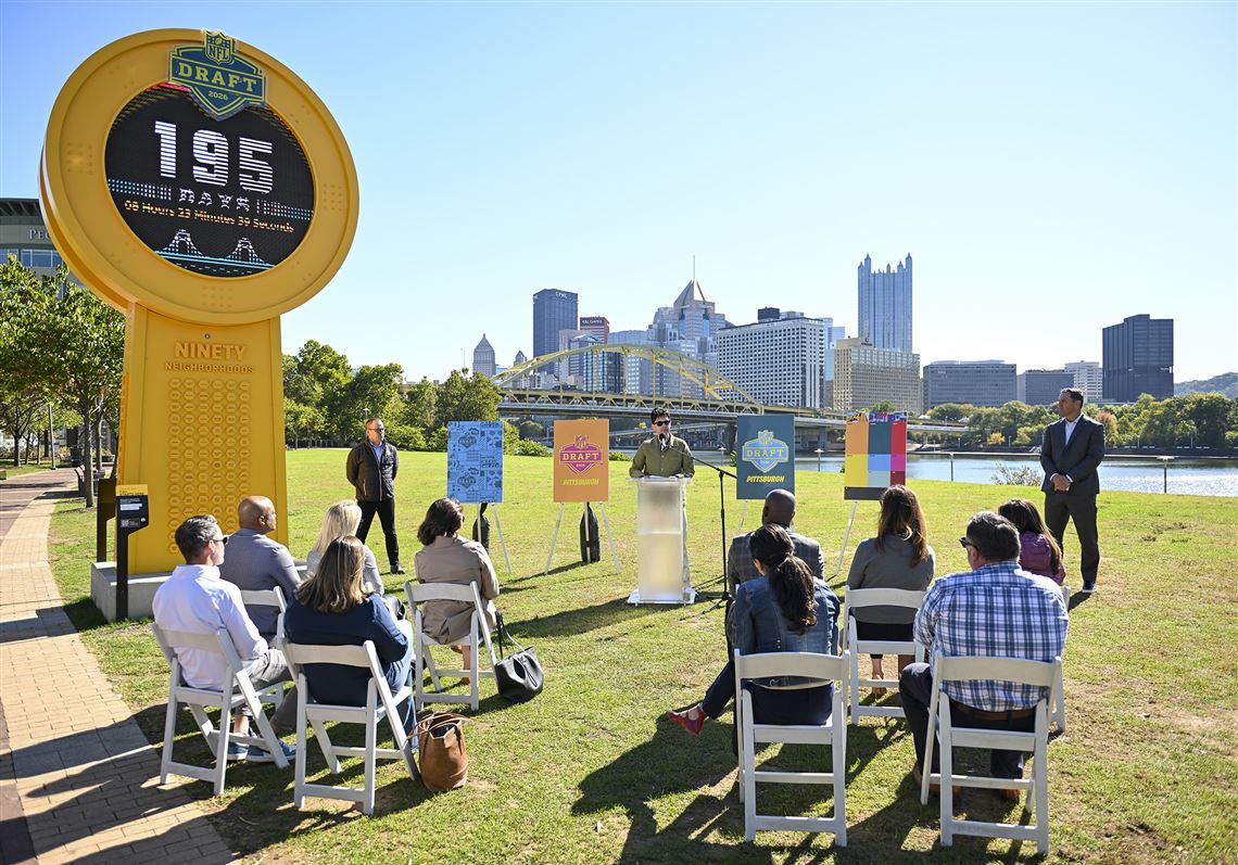 Pittsburgh football fans sit out on the North Shore looking at where tons of NFL fans will be standing in the coming days to see their favorite team pick the future star of their team. 