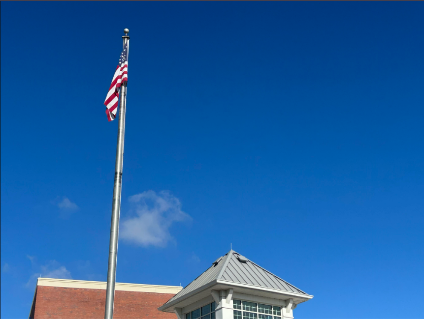 Trinity High School’s American flag, raised high, in all its glory.  Trinity has been established for a little over 100 years now and has been around for many of America’s developments.