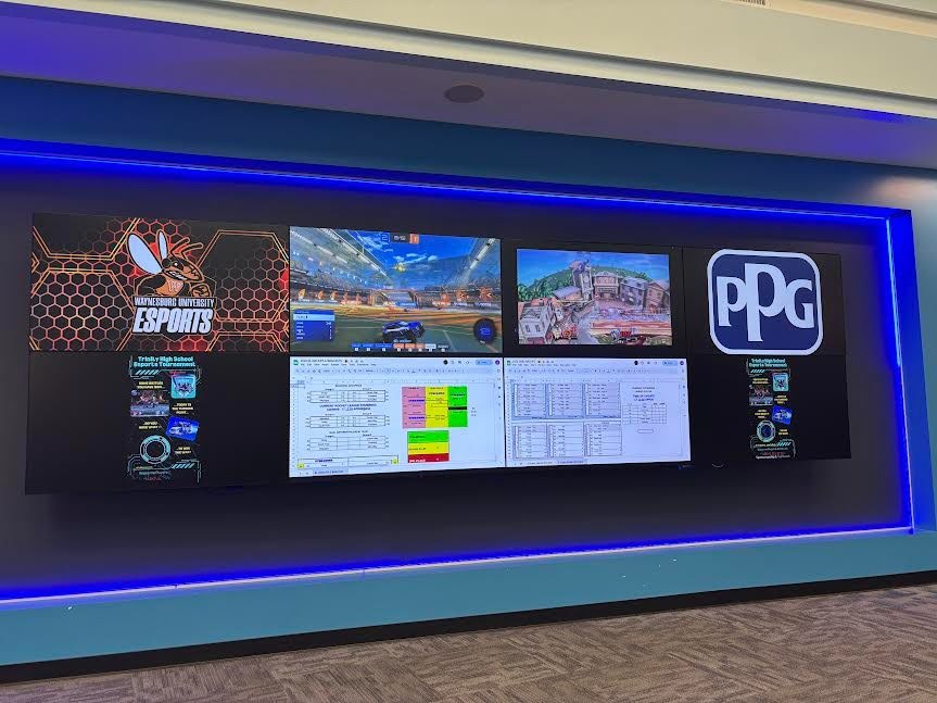 This was the setup for the displays at the Middle School Media Center. PPG helped sponsor this tournament and the two games being streamed are shown on the top middle screens with Rocket League on the left center and Super Smash Bros on the right center.