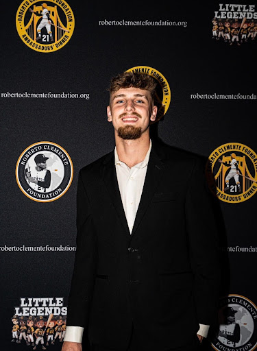 Zach Schrader poses for the Roberto Clemente foundation’s Little Legends program, the program he has done much work for.
